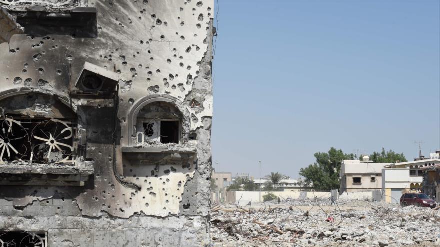Parte de la pared de un edificio llena de huellas de balas disparadas por fuerzas saudíes, la localidad de Al-Qatif, 1 de octubre de 2017. (Foto: AFP)