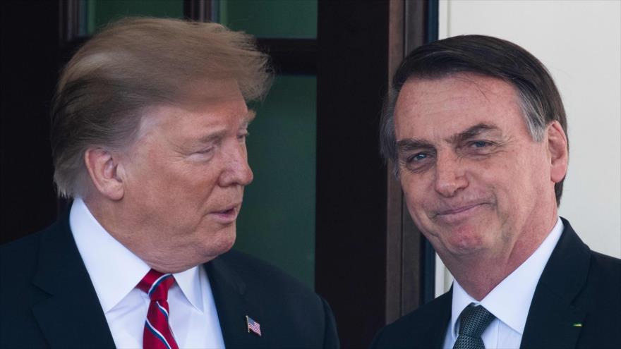 El presidente de EE.UU., Donald Trump, (izda.), junto a par brasileño, Jair Bolsonaro, en la Casa Blanca en Washington D.C., el 19 de marzo de 2019. (Foto: AFP)