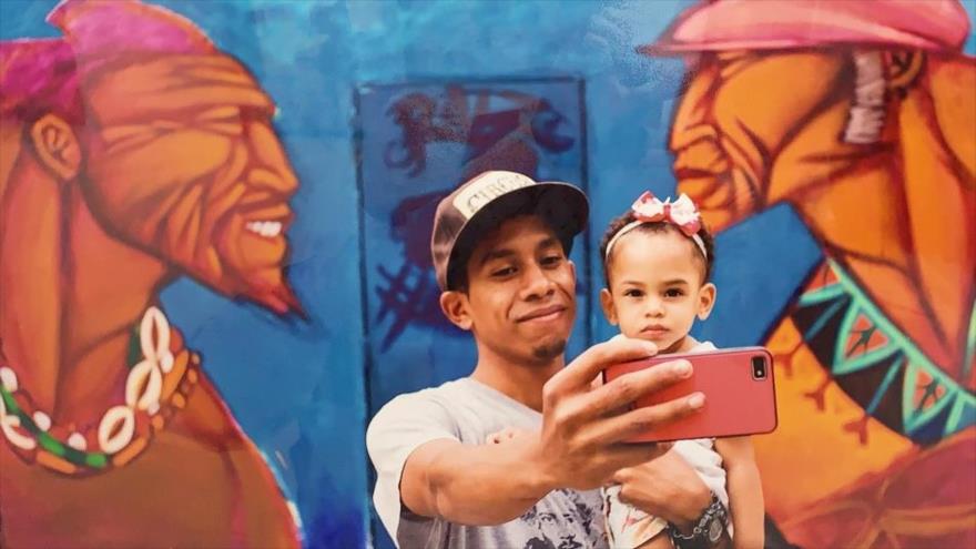 Una foto exhibida en la exposición Nuestro Oficio sobre la realidad del pueblo venezolano ante las sanciones de EE.UU., 24 de septiembre de 2019. 