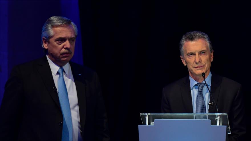 El presidente de Argentina, Mauricio Macri (dcha.), y el candidato presidencial Alberto Fernández, 13 de octubre de 2019. (Foto: AFP)