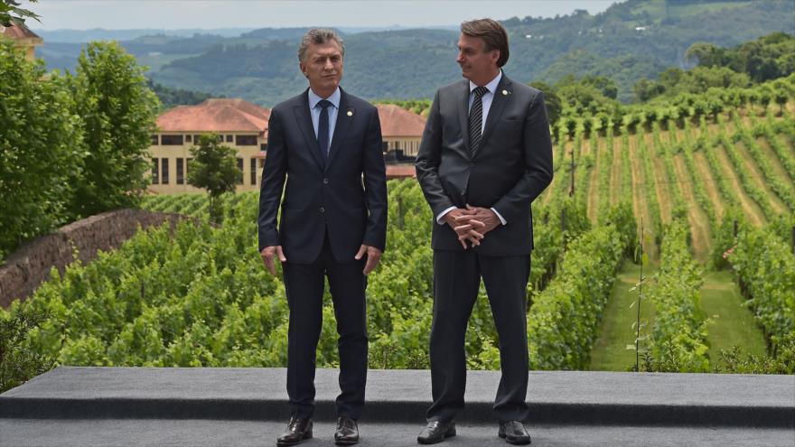 El presidente de Brasil, Jair Bolsonaro (dcha.), con su homólogo argentino, Mauricio Macri, en Bento Goncalves, Brasil, 5 de diciembre de 2019. (Foto: AFP)