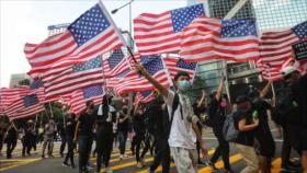 China: Oenegés de EEUU alientan disturbios violentos en Hong Kong