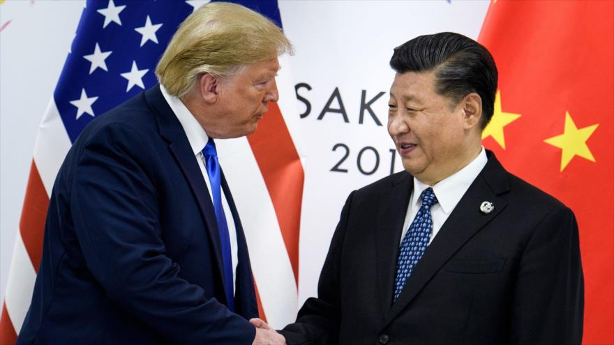 El presidente chino, Xi Jinping (dcha.) y su homólogo estadounidense, Donald Trump, en Osaka (Japón), 29 de junio de 2019. (Foto: AFP)