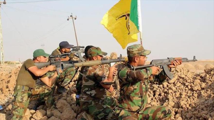 Miembros del Movimiento de Resistencia Islámica de Irak, conocido como Kataeb Hezbolá.