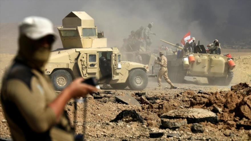 Fuerzas populares de Irak limpian de Daesh la frontera con Siria | HISPANTV