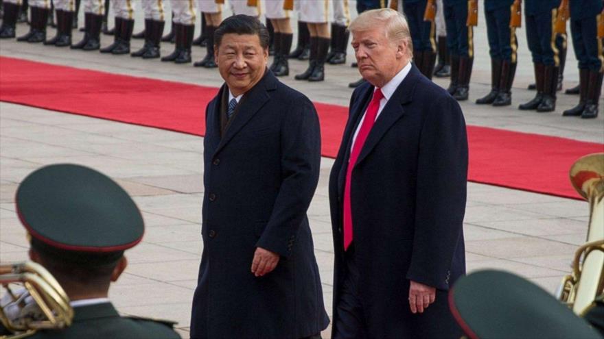El presidente de EE.UU. (drcha.), Donald Trump, y su par chino, Xi Jinping.