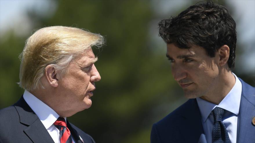 El presidente de EE.UU., Donald Trump (izda.), y el premier canadiense, Justin Trudeau, durante la cumbre del Grupo de los Siete (G7), 9 de junio de 2018.