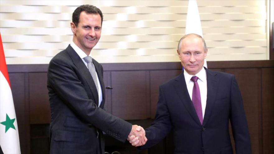 El presidente de Rusia, Vladimir Putin (dcha.), y su homólogo sirio, Bashar al-Asad.
