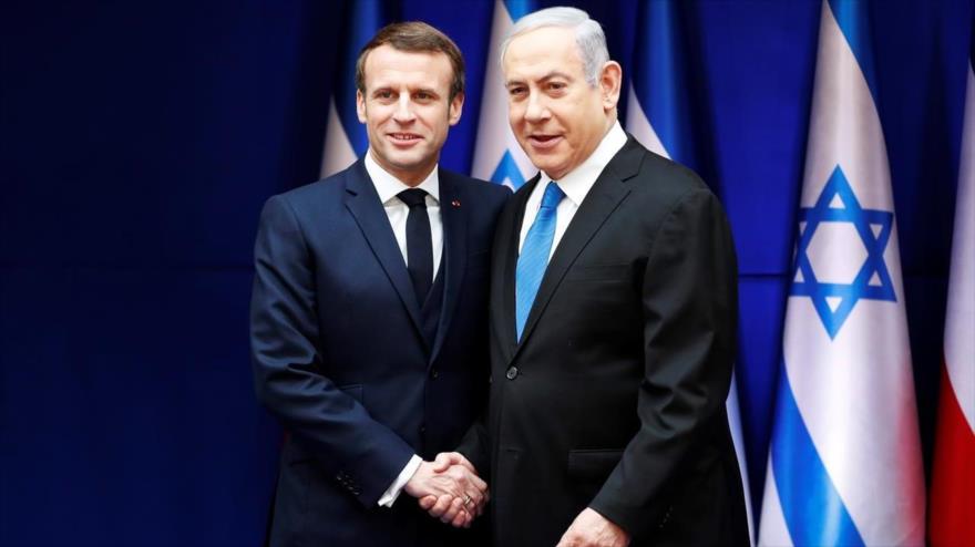 El presidente francés, Emmanuel Macron (izda.) y el premier israelí, Benjamín Netanyahu, en Al-Quds (Jerusalén), 22 de enero de 2020. (Foto: AFP)