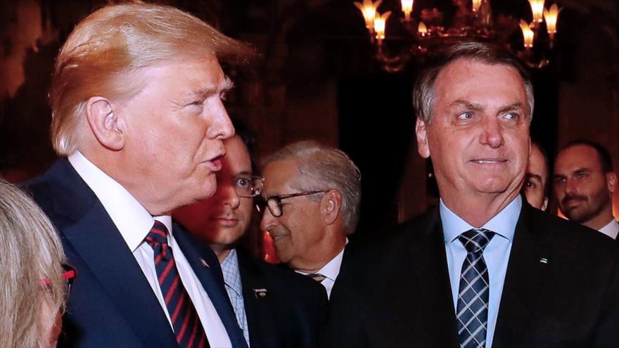 El presidente de EE.UU., Donald Trump (izda.), y su par brasileño, Jair Bolsonaro, Florida, 7 de marzo de 2020. (Foto: AFP)