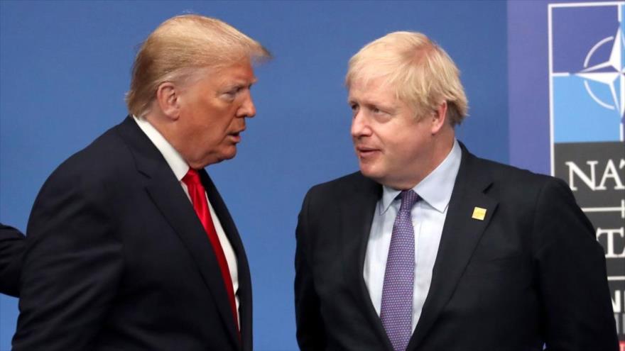 El presidente de EE.UU., Donald Trump (dcha.), y el premier británico, Boris Johnson, en la cumbre de OTAN en Watford, 4 de diciembre de 2019. (Foto: AFP)