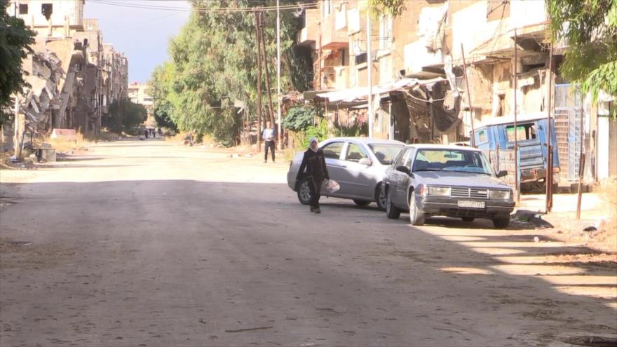 Regreso de refugiados palestinos al campo de Al-Yarmuk en Siria