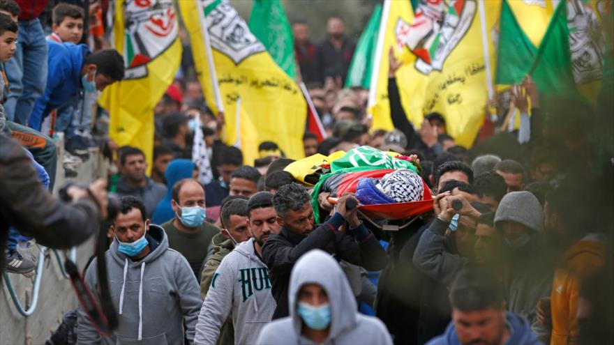 Centenares de palestinos dicen adiós a menor asesinado por Israel