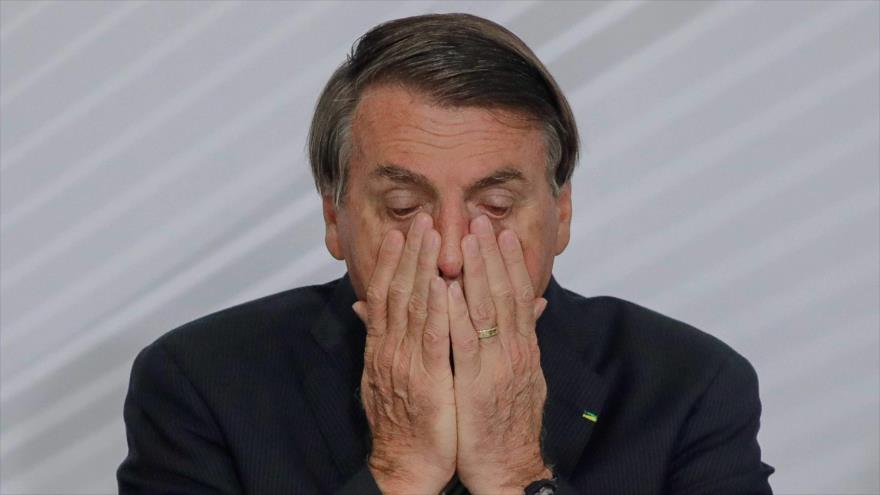 El presidente brasileño, Jair Bolsonaro, en una ceremonia realizada en el Palacio Planalto, Brasilia (la capital), 9 de diciembre de 2020. (Foto: AFP)