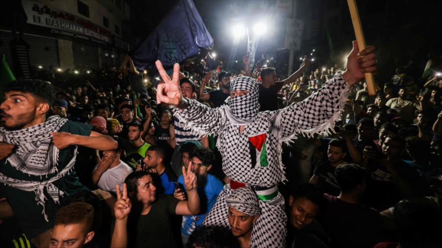 Palestinos celebran victoria de la Resistencia ante Israel en la Franja de Gaza, 21 de mayo de 2021. (Foto: AFP)