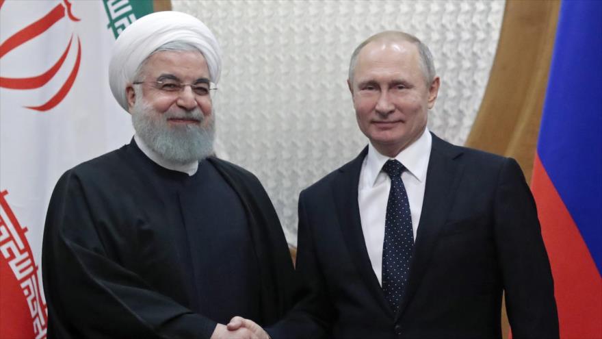 El presidente ruso, Vladimir Putin (dcha.), reunido con su homólogo iraní, Hasan Rohani, en Sochi, en el mar Negro, 14 de febrero de 2019. (Foto: AFP)