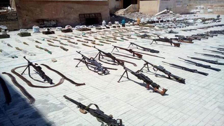 Armas y municiones dejadas por terroristas e incautadas por el Ejército sirio. (Foto: SANA)
