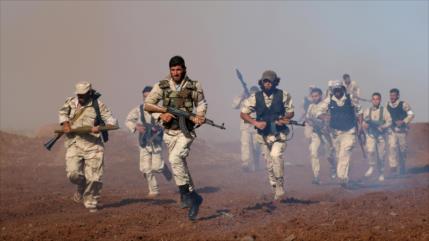 Cientos de milicianos afiliados a EEUU deponen armas en Siria