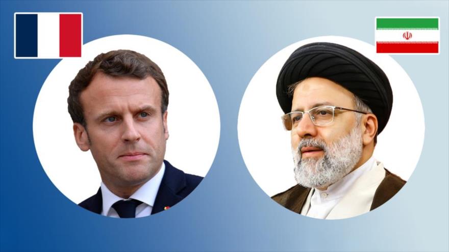 El presidente de Irán, Ebrahim Raisi (dcha.) y su homólogo francés, Emmanuel Macron.