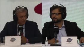 Candidatos a balotaje en Chile se enfrentaron en tenso primer debate