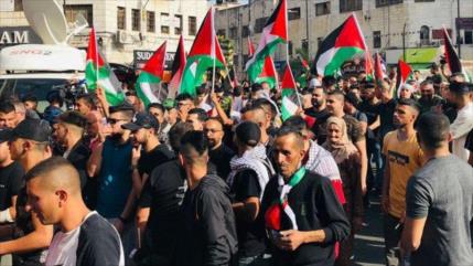 Palestinos protestan contra ‘marcha de banderas’ de israelíes