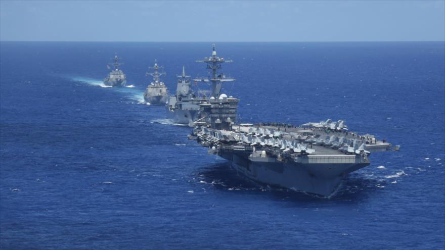 Portaviones estadounidense USS Abraham Lincoln, junto a un grupo de ataque navega en el océano Pacífico, 23 de junio de 2022. (Foto: U.S. Navy)