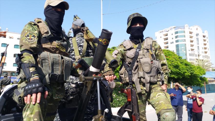 Combatientes del movimiento Yihad Islámica Palestina realizan un desfile militar en Gaza, 29 de mayo de 2021.