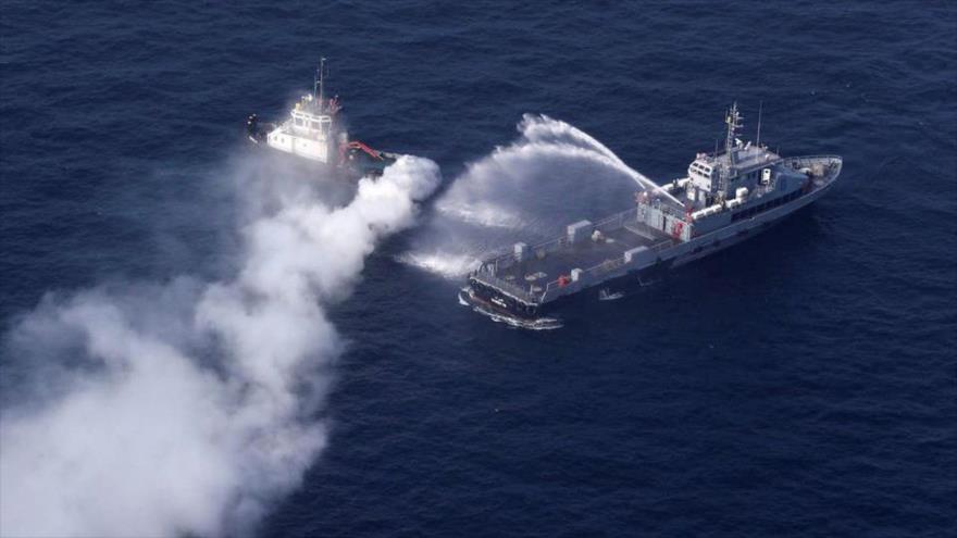 Buques de guerra se ven durante un ejercicio naval conjunto de las Armadas iraní, china y rusa en el norte del Océano Índico, 20 de enero de 2022. 