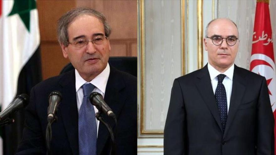 Los ministros de Asuntos Exteriores de Siria, Faisal al-Miqdad (izq.), y de Túnez, Nabil Amar.