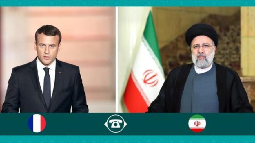 El presidente de Irán, Ebrahim Raisi (derecha), y su homólogo francés, Emmanuel Macron. 