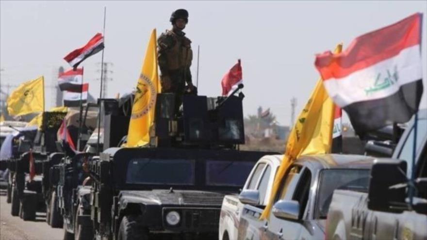 Combatientes del movimiento de Resistencia iraquí Hezbolá Al-Nuyaba durante un desfile en Bagdad.
