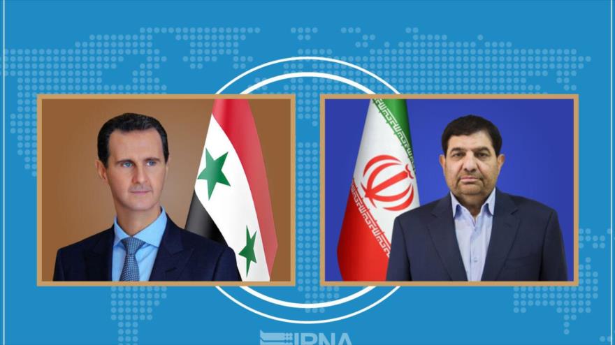 El presidente de Siria, Bashar al-Asad y el presidente en funciones de Irán, Mohamad Mojber Dezfuli.