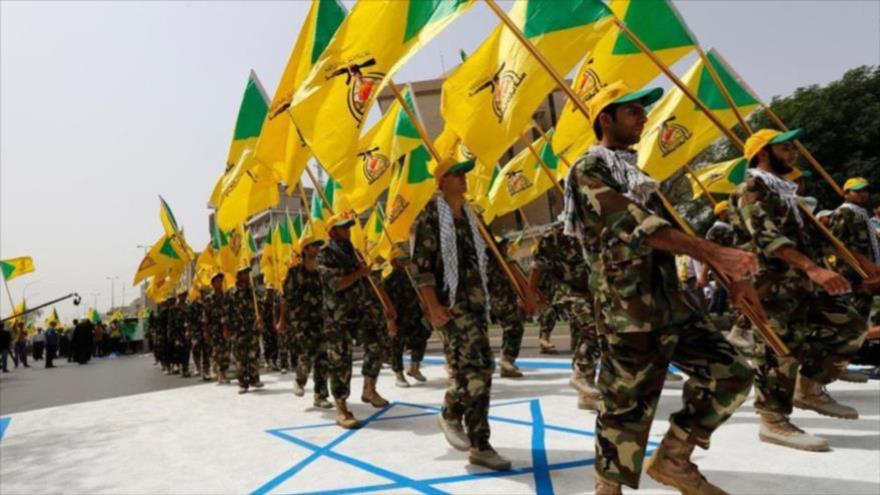 Miembros del movimiento antiterrorista Kataib Hezbolá, en un desfile en Bagdad, la capital de Irak. (Foto: Reuters)