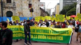 Marchan en Colombia por justicia para víctimas de la Unión Patriótica