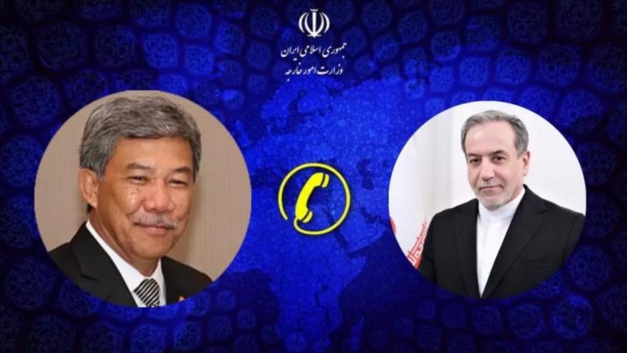 El canciller iraní, Seyed Abás Araqchi (drcha.) y su par malasio, Mohamad Hasan.