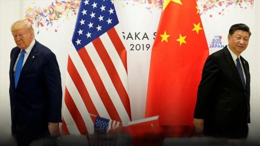 Los presidentes de China, Xi Jinping, y el de EE.UU., Donald Trump (izqda.).