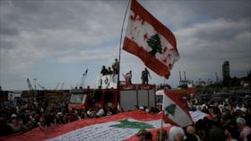Libaneses rechazan desarme de Hezbolá en una marcha en Beirut