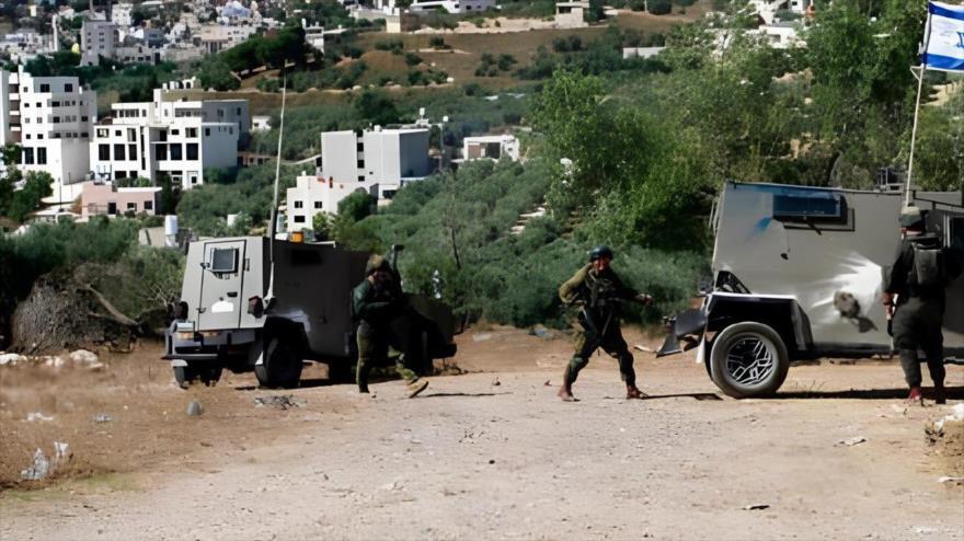 Soldados israelíes en la aldea de Burin, cerca de la ciudad cisjordana de Nablus,18 de junio de 2024.